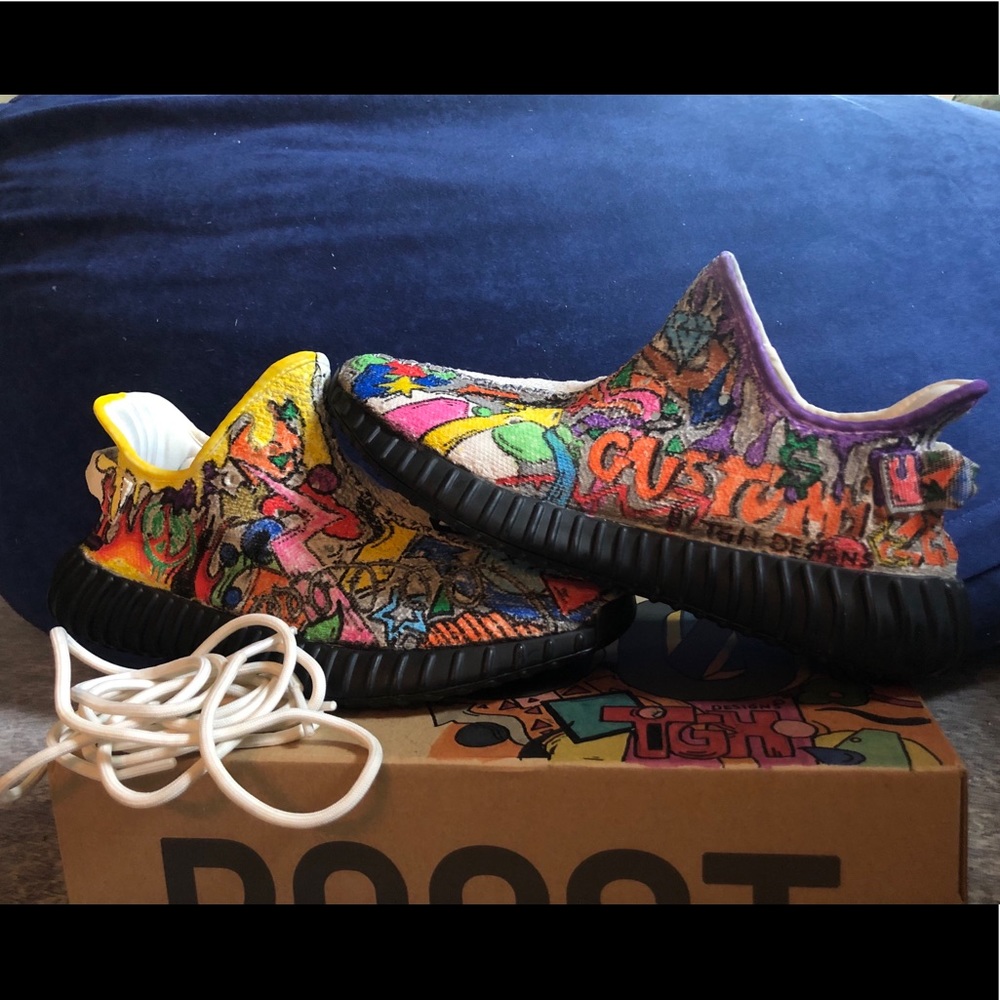 Adidas Yeezy boost 350 triple white sneakers.